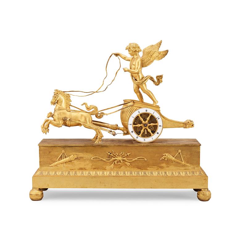 A French Empire early 18th century gilt bronze mantel clock.