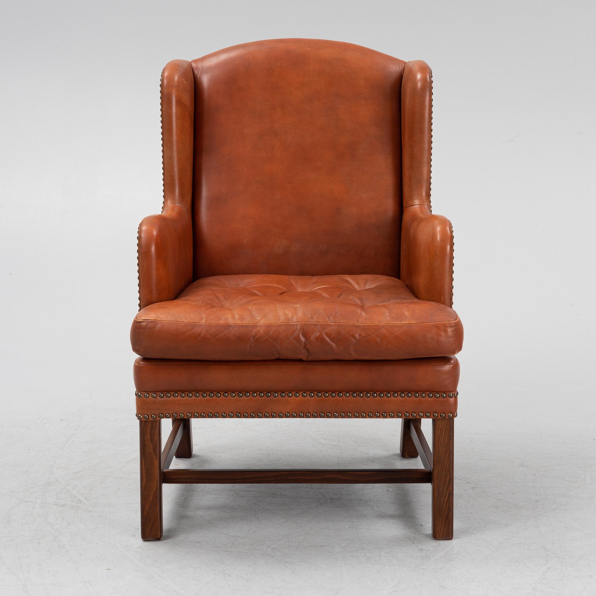 A leather upholstered easy chair, second part of the 20th Century.