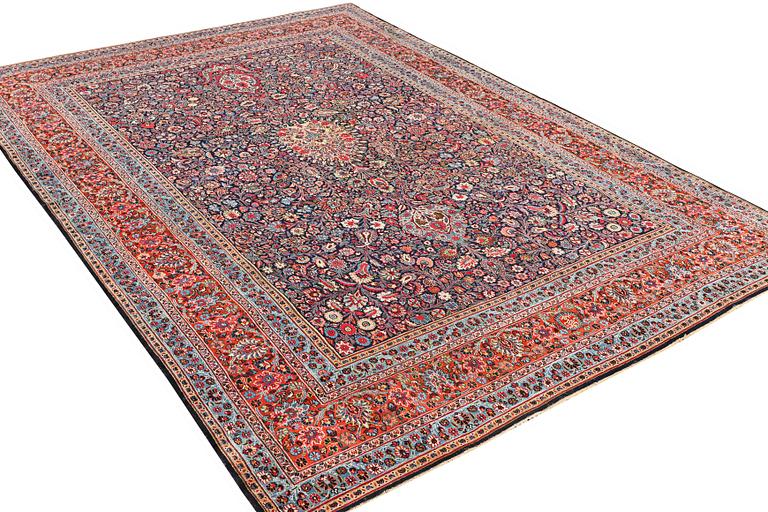 A semi-antique Meshad carpet, a. 360 x 252 cm.