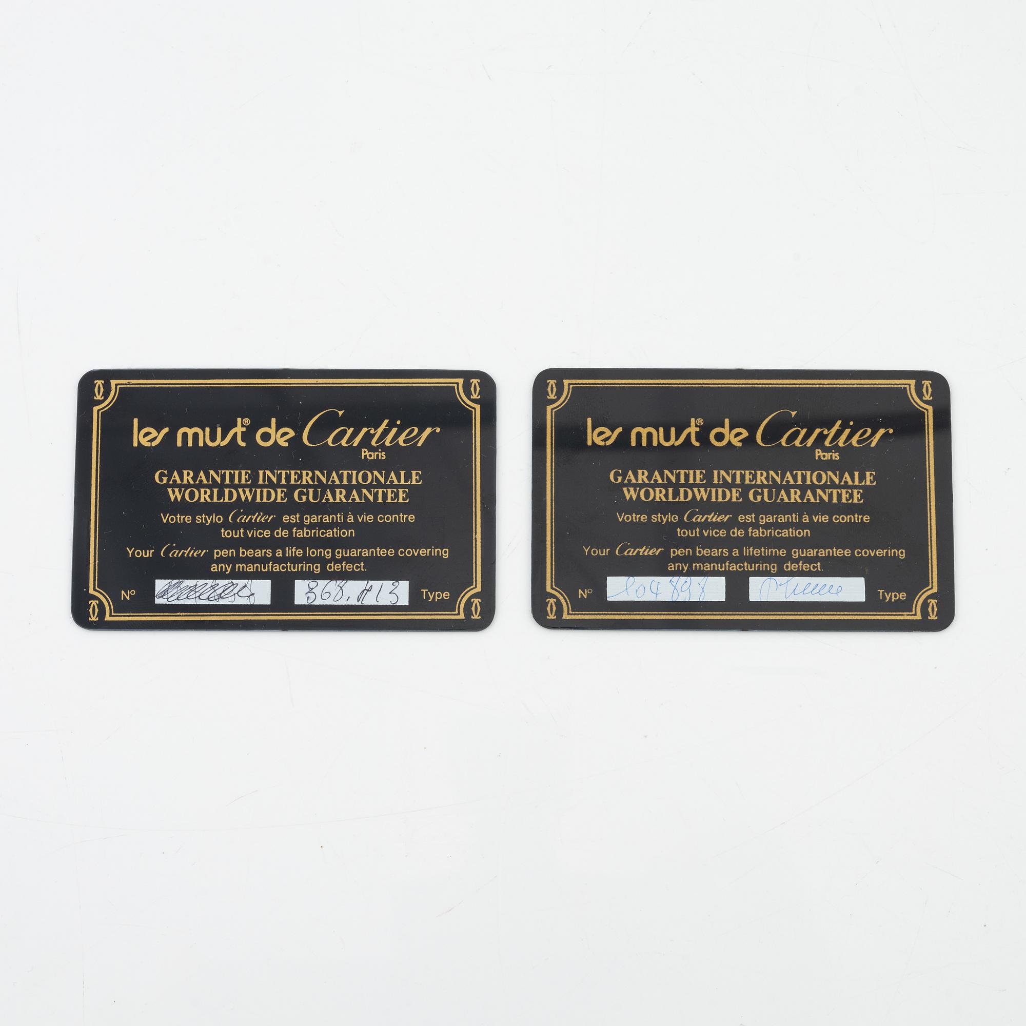 Les Must de Cartier, two gold plated 'Vendôme Trinity' pens.