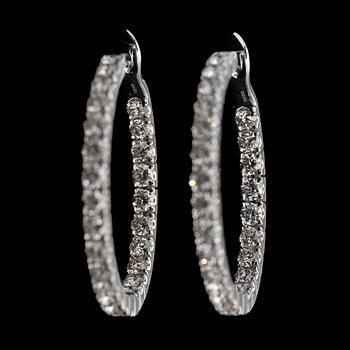 A pair of brilliant cut diamond earrings, tot. 3.94 cts.