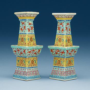 1654. A pair of famille rose altarsticks, late Qing dynasty.
