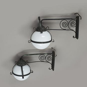 A pair of 1920's copper and glass outdoors wall lights.