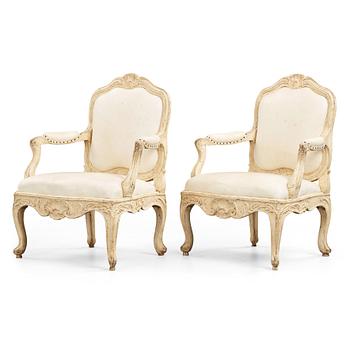 A pair of Swedish Rococo 18th century armchairs attributed to Carl Magnus Sandberg (master in Stockholm 1759-1789).