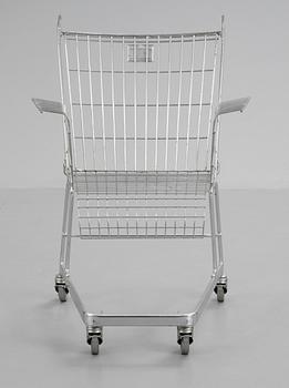A Frank Schriener 'Consumer's Rest'  galvanized steel wire shopping cart chair, model 2, Stiletto Studios,