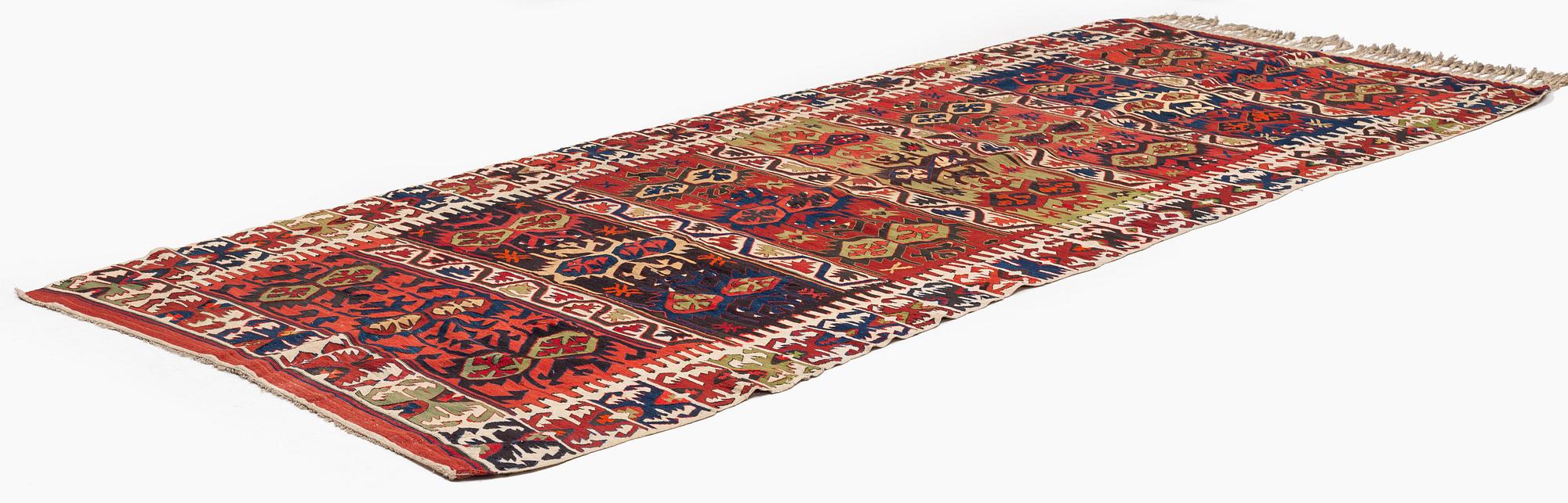 An antique southeast Anatolian kilim, c. 412 x 163 cm.