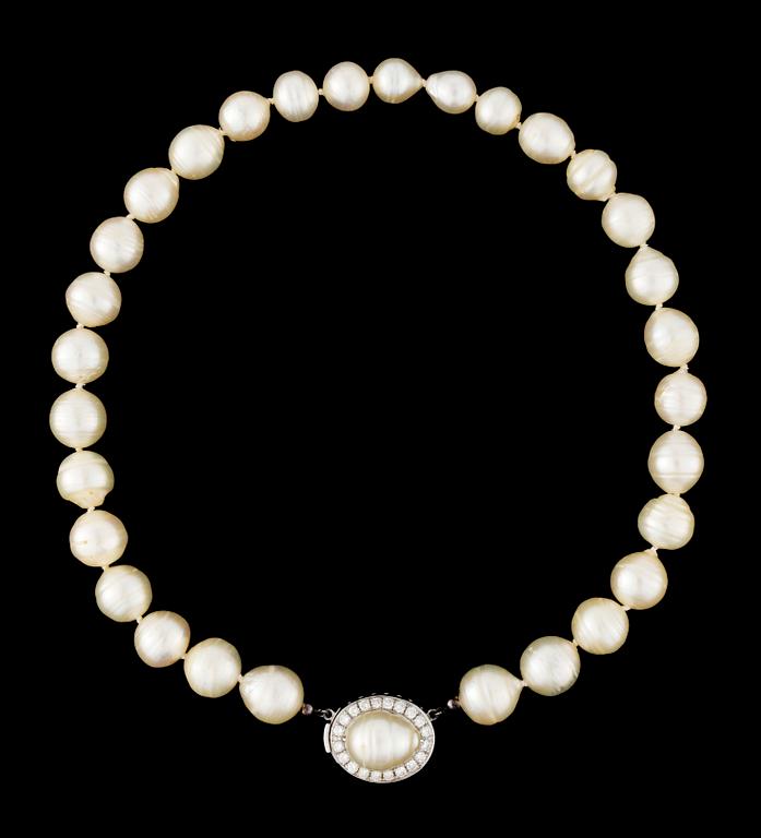 A cultured pearl necklace, with diamond and pearl clasp.