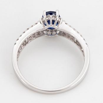 Kyanite and brilliant-cut diamond ring.
