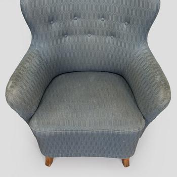 A pair of mid-20th century armchairs.