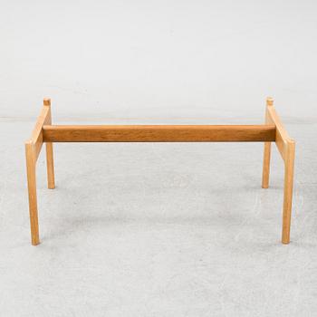 A model JH 575 coffee table by Hans J Wegner for Johannes Hansen.