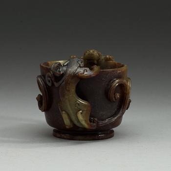 A Chinese nephrite cup with handles.