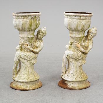 An end of the 20th Century pair of cast  iron flower pots.