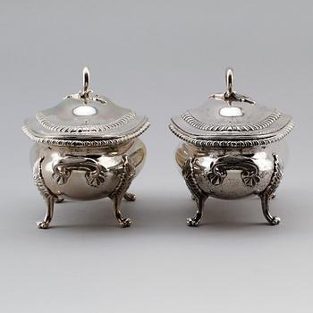 A pair of English 18th century silver sauce-tureens, marks of Sebastian & James Crespell, London 1772.