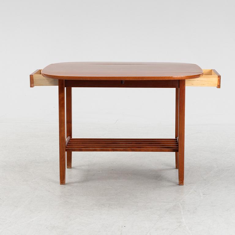 A mahogany side table, second half of the 20th Century.