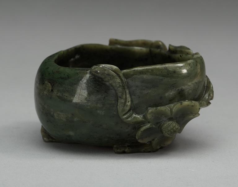 A carved nephrite brush washer, Qing dynasty.