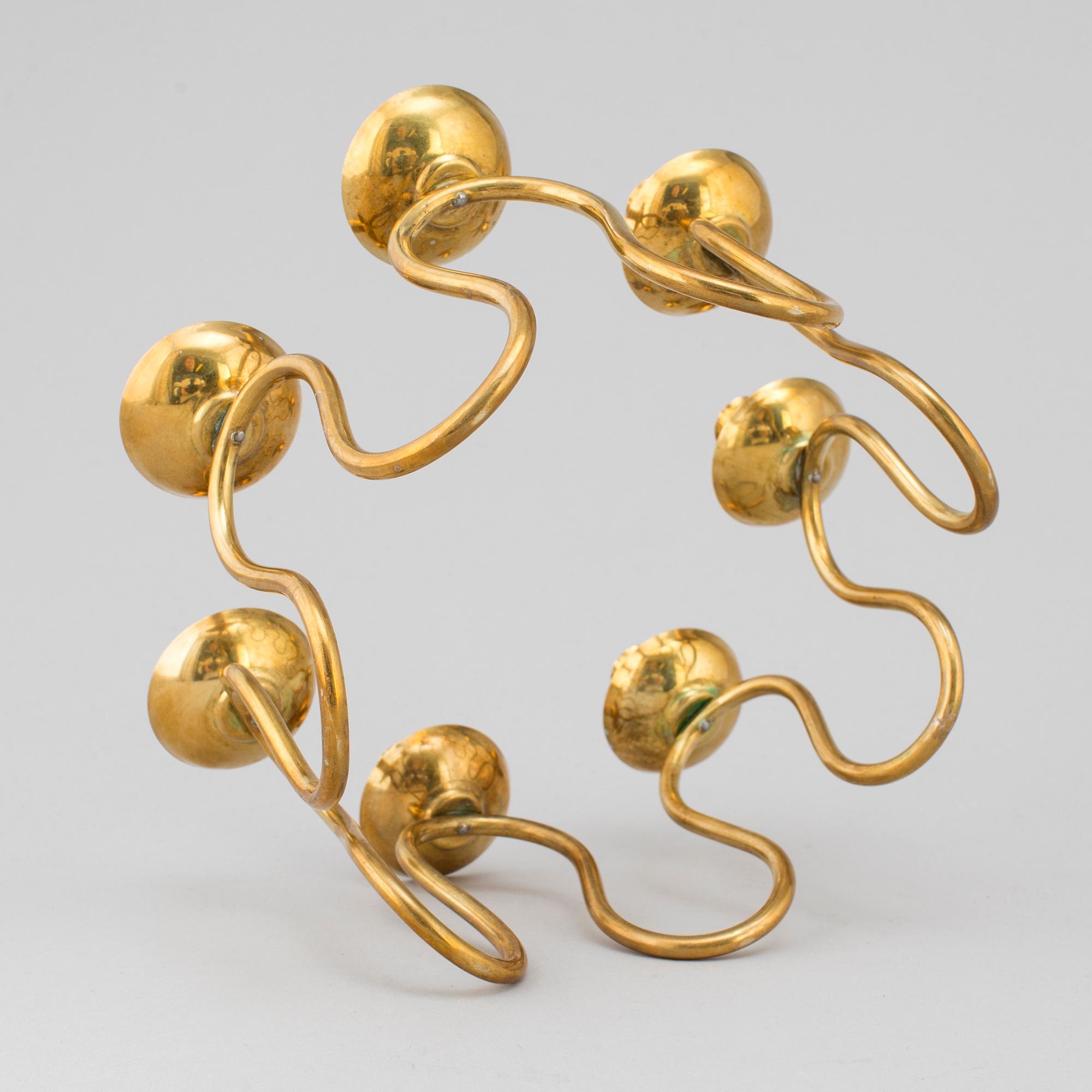 LARS HOLMSTRÖM, a brass candlestick.