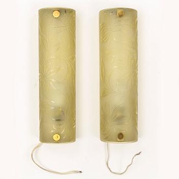 A pair of 1940s glass and metal wall lights.