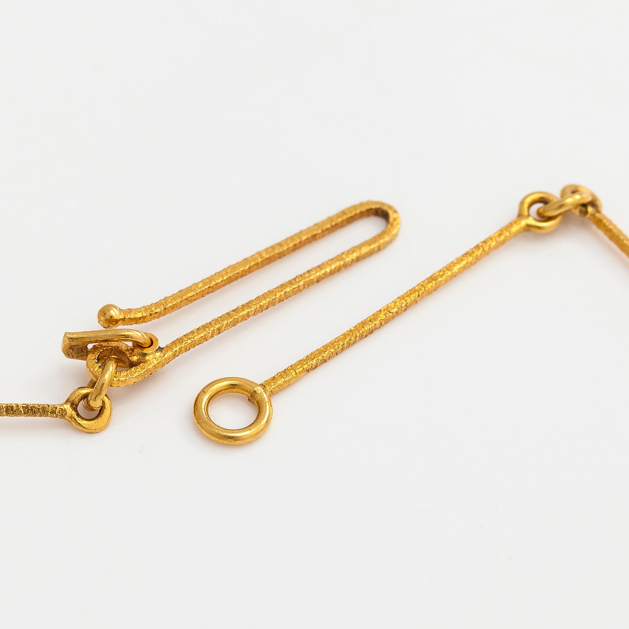 Björn Weckström, an 18K gold 'Nymph's Eye' necklace with a tourmaline. Lapponia.