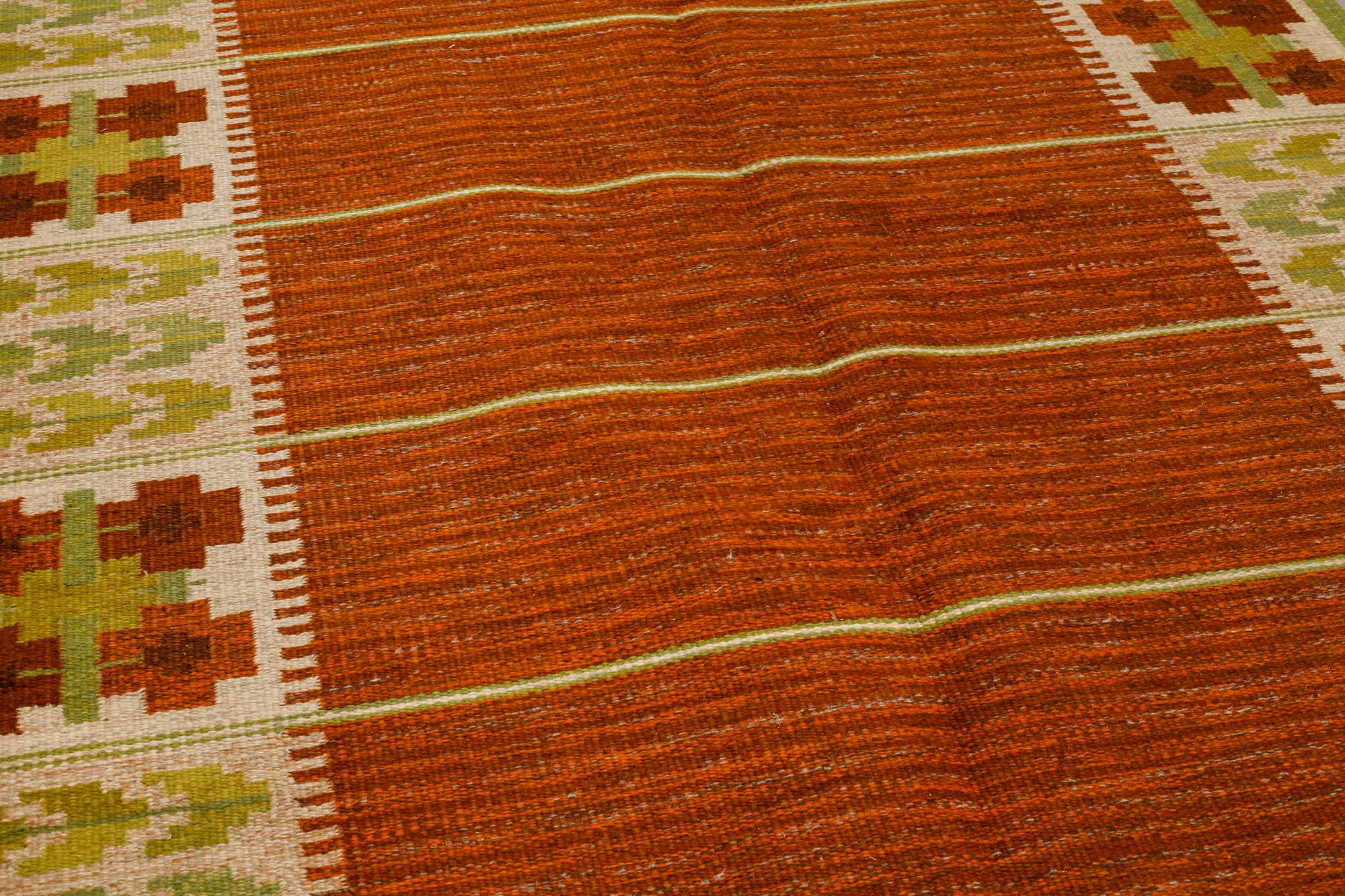 A flat weave by Berit Woelfer, signed BW, third quarter of the 20th century, 238 x 197 cm.