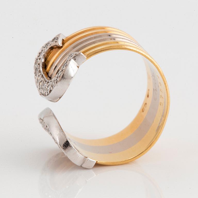 A Cartier "Double C" ring in 18K tri color gold set with round brilliant-cut diamonds.