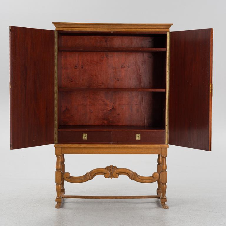 A leather, oak and mahogany cabinet, mid 20th Century.