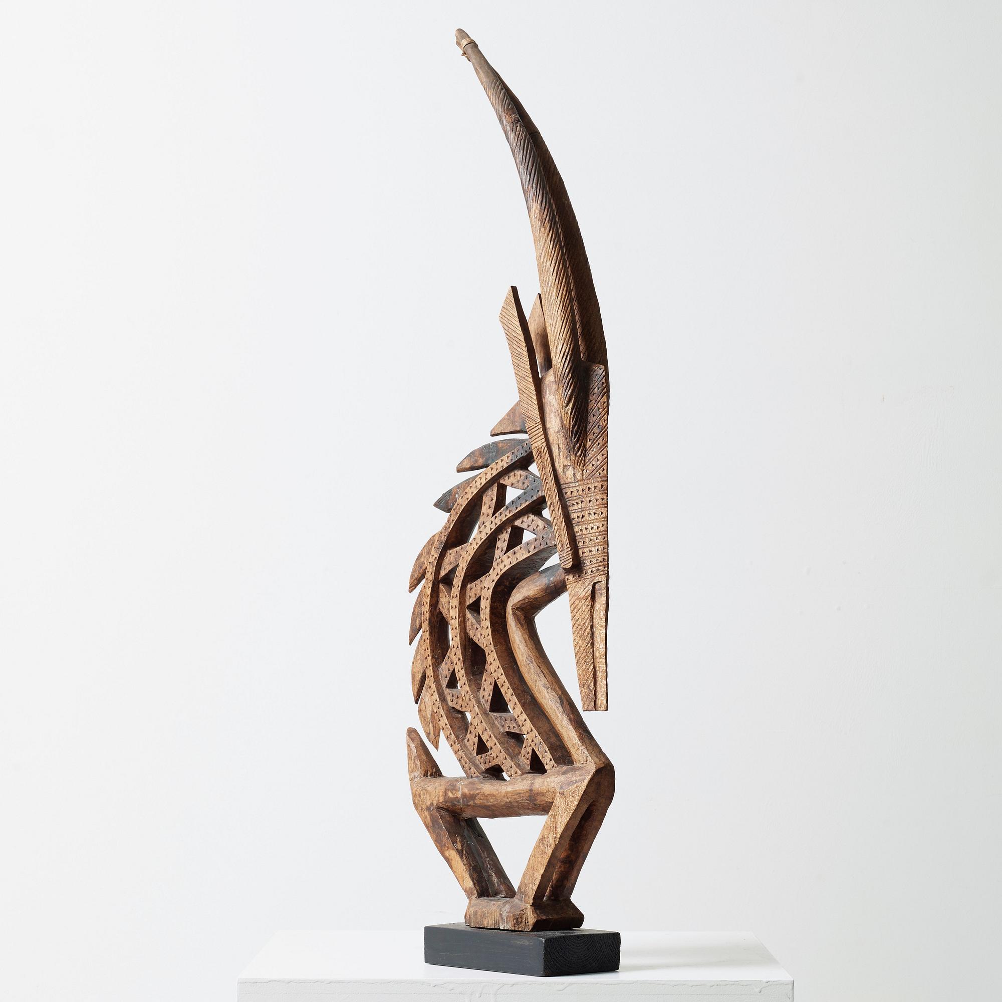 HEADDRESS Tshiwara/Ciwara (stylized male antelope). Wooden sculpture.