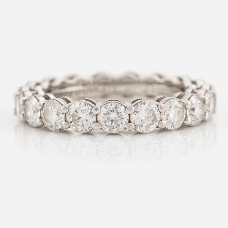 A platinum Tiffany & Co eternity ring set with round brilliant-cut diamonds.