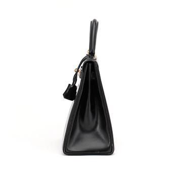 HERMÈS, a black leather bag, "Kelly 32".