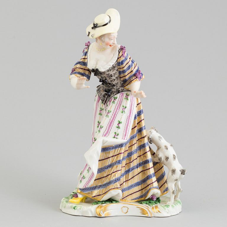 A Nymphenburg porcelain figure of a lady with a dog, Germany, 20th Century.