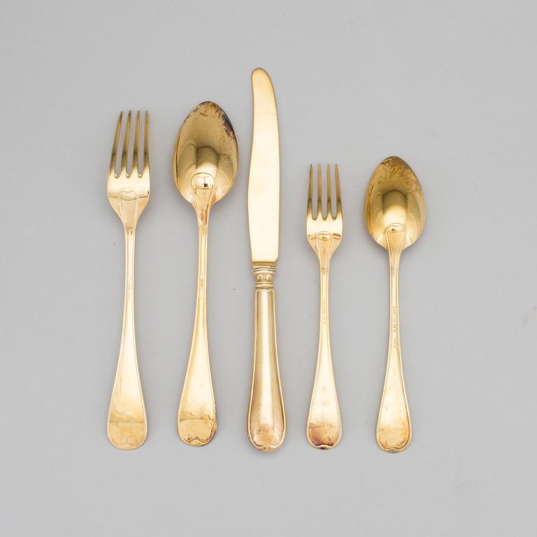 A set of 60 pieces of cutlery gilded sterling silver by CG Hallberg in Stockholm 1957-1961. Total weight c. 3950 gram.