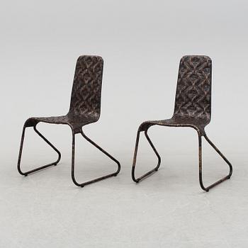 A pair of 'Flo-chairs' by Patricia Urquiola for Driade.