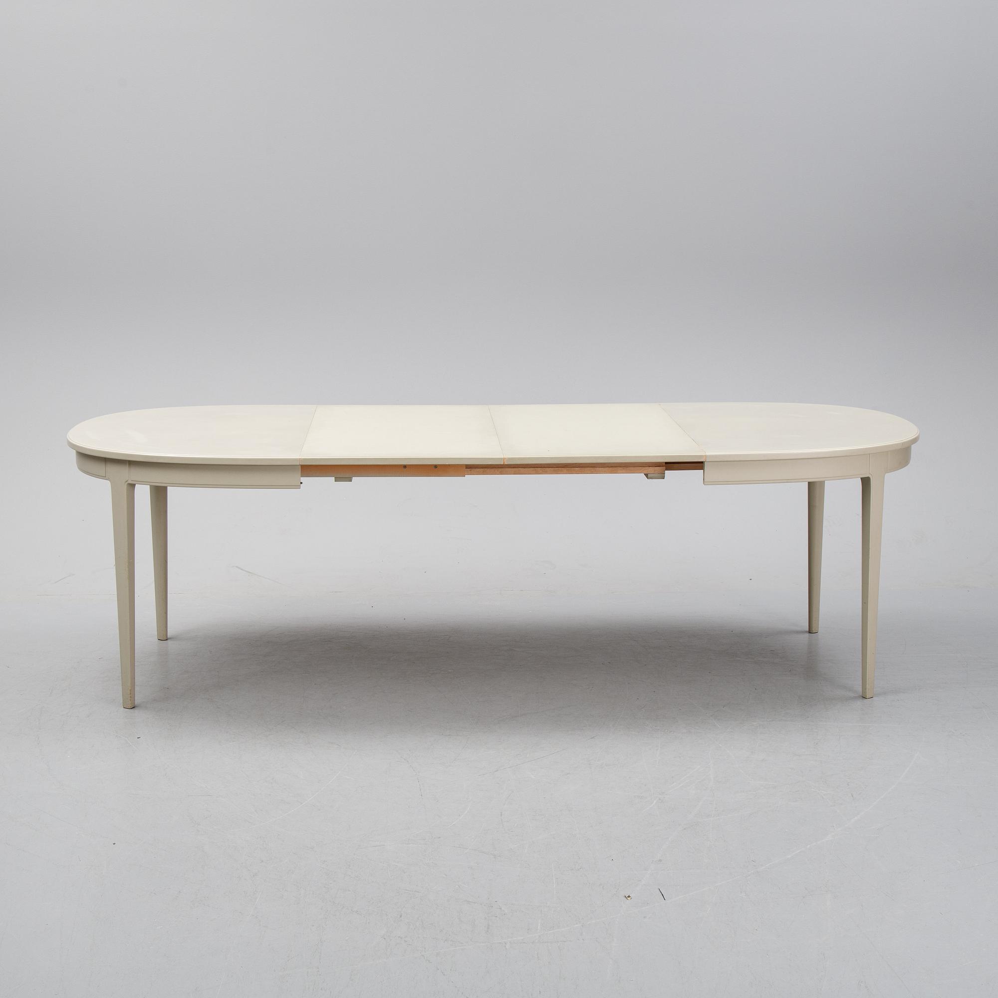 A dining table and six chairs by Carl Malmsten for Bodafors.