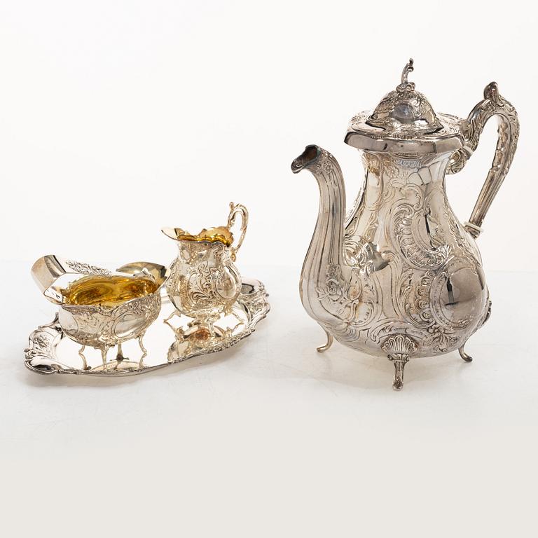 A Swedish silver Rococo style 4-piece coffee service, mark of Gewe, Malmö 1962-1978, and sugar tongs, Mylius, Norway.