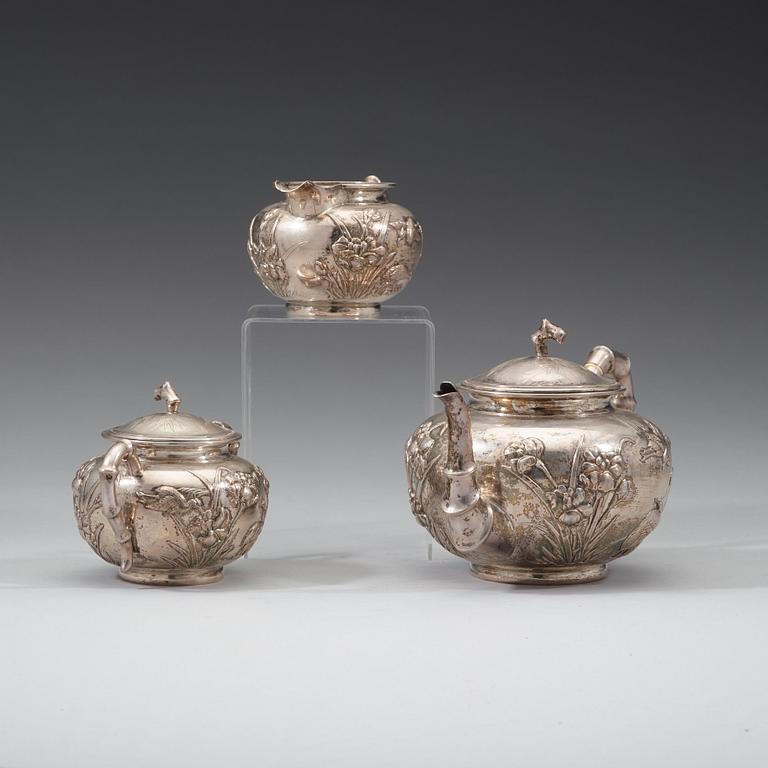 A three piece export silver tea service, Shanghai, early 20th Century.