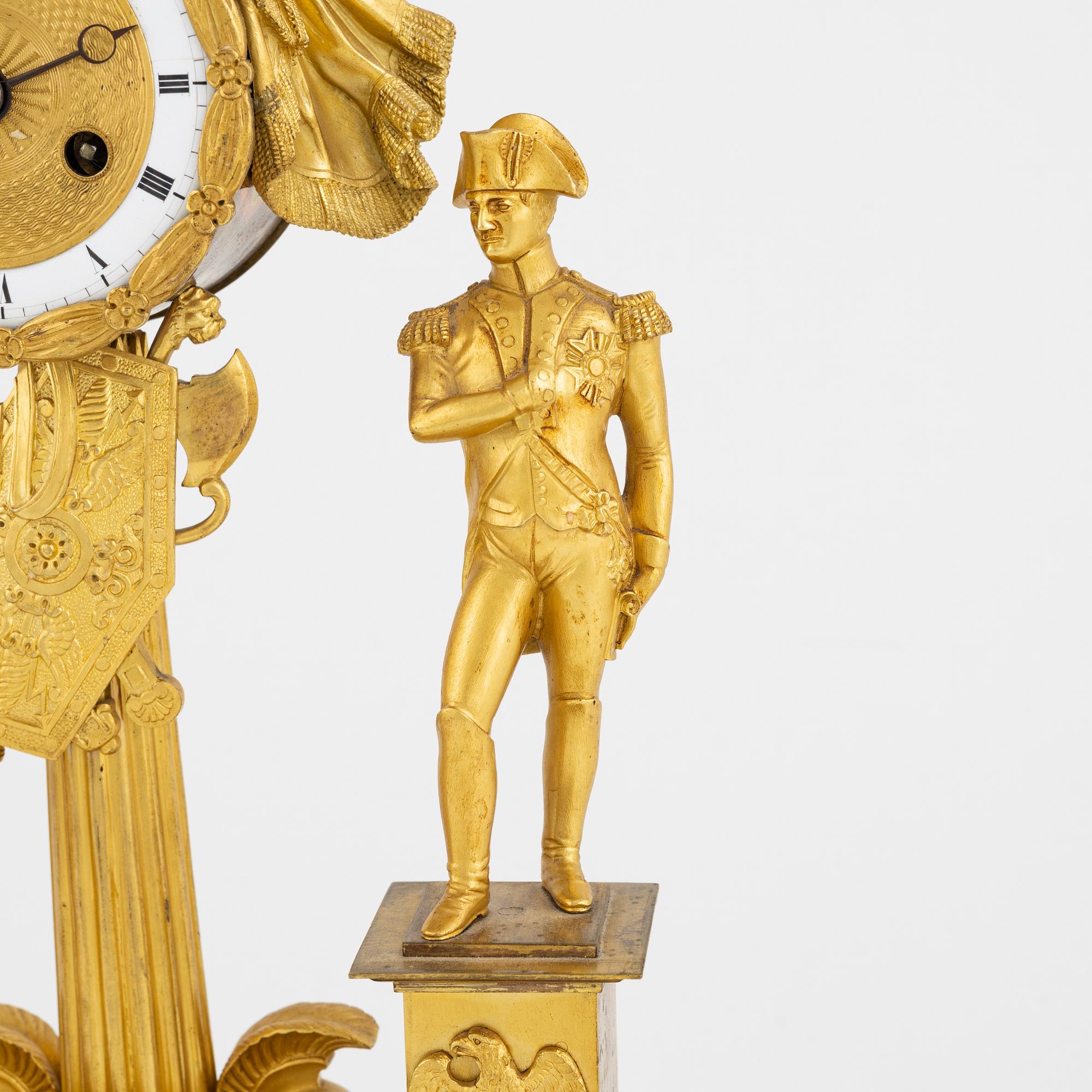 A French Empire ormolu figural mantel clock, early 19th century.