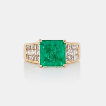 749. An emerald, circa 3.5 cts, and diamond, circa 1.95 cts, ring.