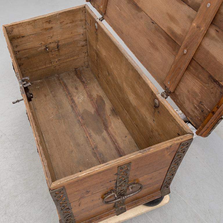 A 18th century baroque oak chest with iron mountings.