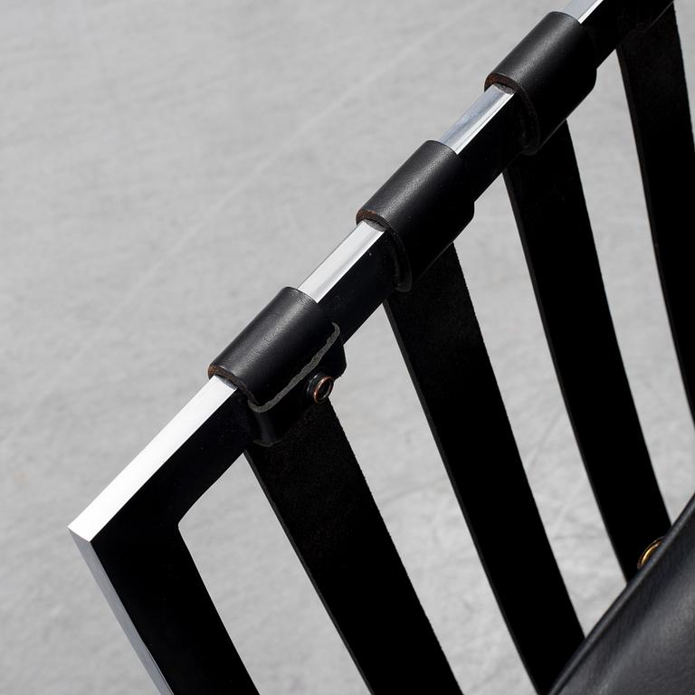 LUDWIG MIES VAN DER ROHE, a 'Barcelona' black leather lounge chair, Knoll Studio.