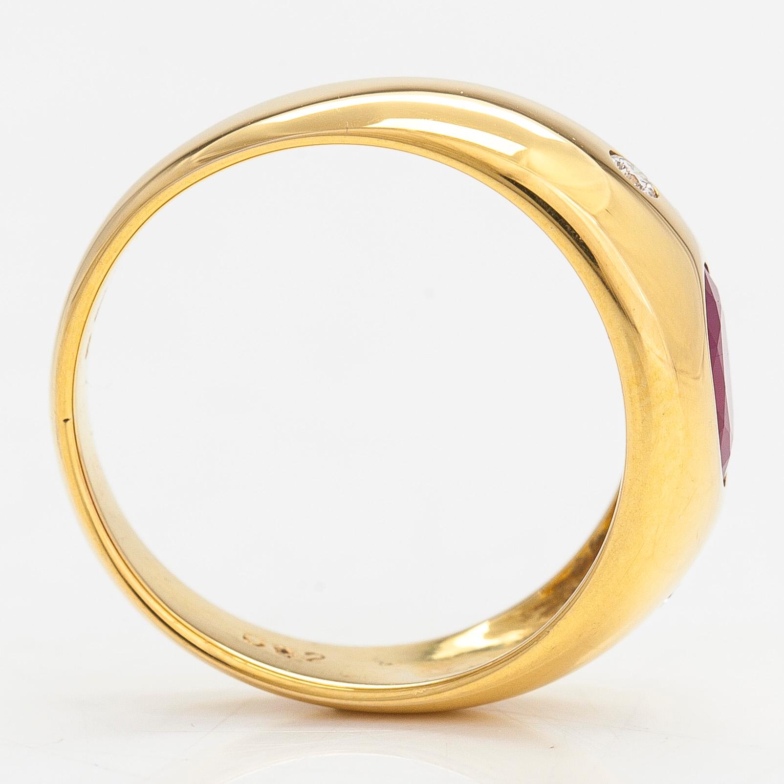 A 14K gold ring, set with an oval-cut ruby and diamonds totaling approx. 0.06 ct. Finland, 1999.