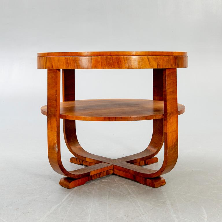 An Art Deco style walnut coffee table later part of the 20th century.