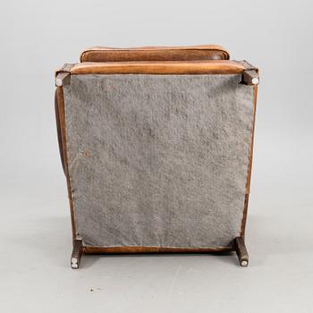 A Chesterfield style armchair from the latter part of the 20th century.