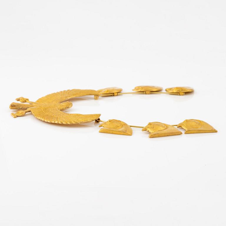 A modern Egyptian-style gold necklace.