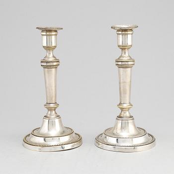 A pair of late 18th century/early 19th century plate candlesticks.