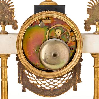 A late Louis XVI ormolu and marble portico clock, Paris, latge 18th century.