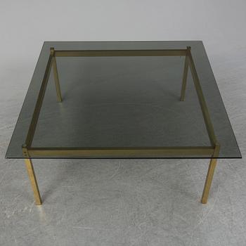 A 1960-70's brass and glass coffee table.