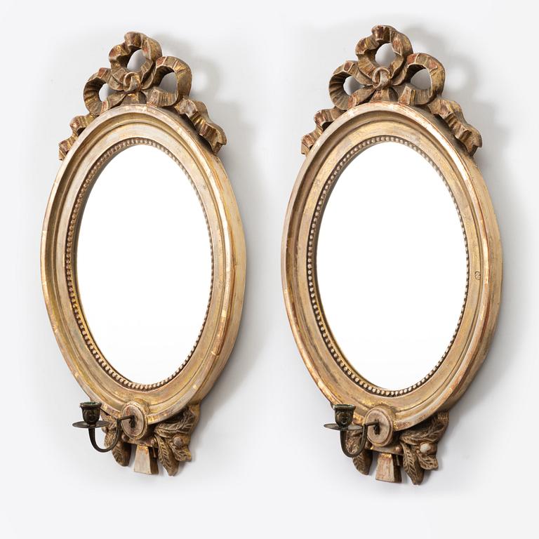 A pair of Gustavian one-light girandole mirrors, 20th century.