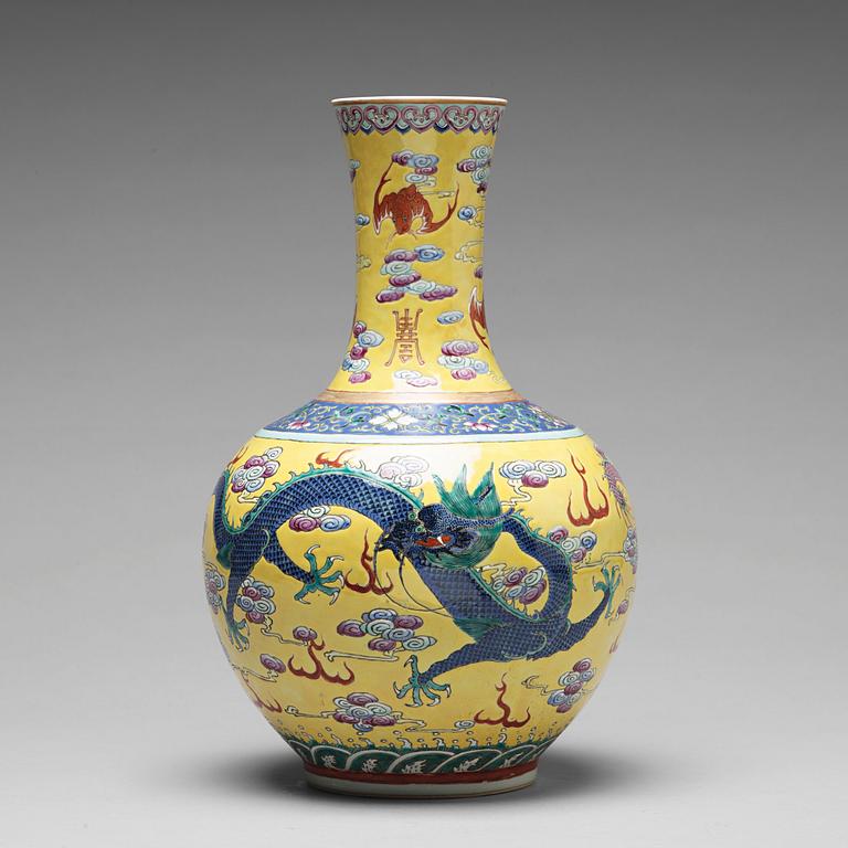 A yellow glazed five clawed dragon vase, probably late Qing dynasty with Guangxus mark.