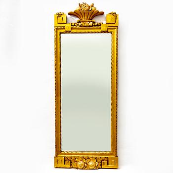 A gilded mid 1900s Gustavian style mirror.