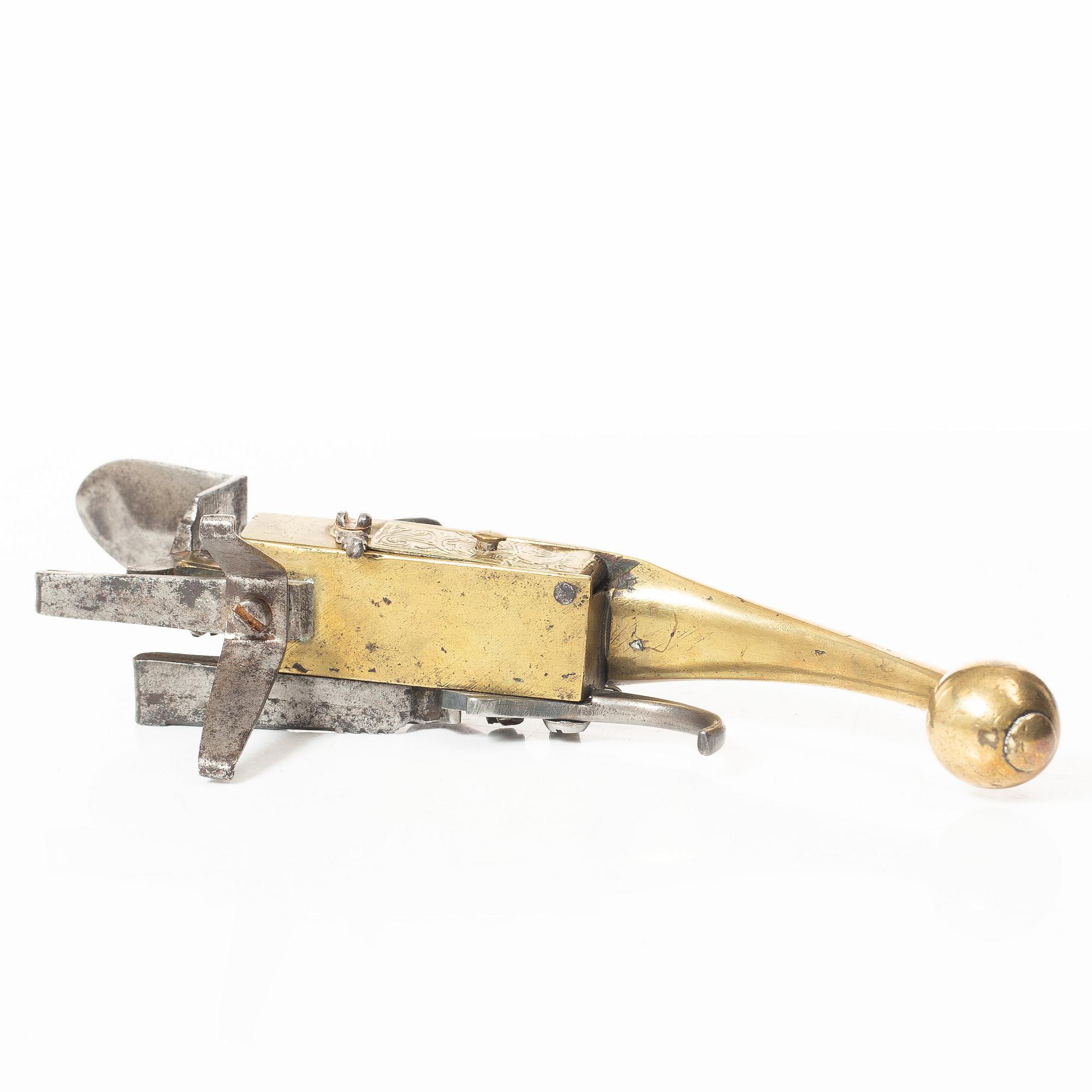 A Northern European flintlock lighter, mid 18th century.