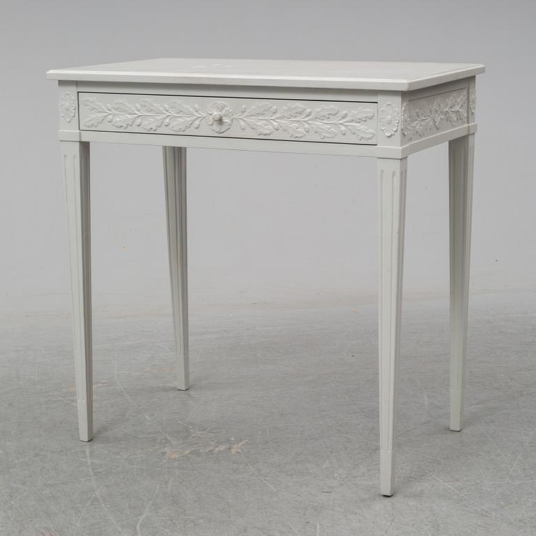 A late Gustavian style table with a drawer from around year 1900.